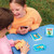 A lifestyle image of an EeBoo Snap! Card Game in use.