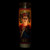 A lifestyle image of a lit Unemployed Philosopher's Guild Secular Saint Candle, Frida Kahlo.